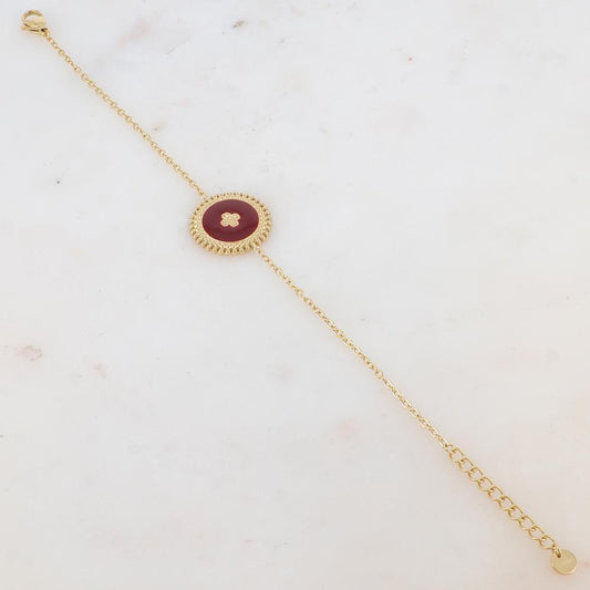 Bracelet avec pièce ronde émaillée, fleur gravée