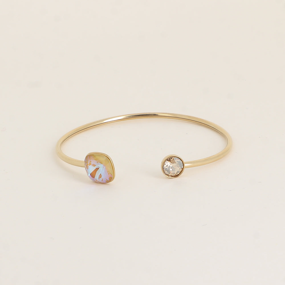 Jonc orné de cristaux de Swarovski® 10 mm et SS29 - Hauteur du jonc: 11 mm - Dimension du cristal 1: 10x10 mm - Diamètre du cristal 2: 7 mm - Ochre delite and Golden shadow
