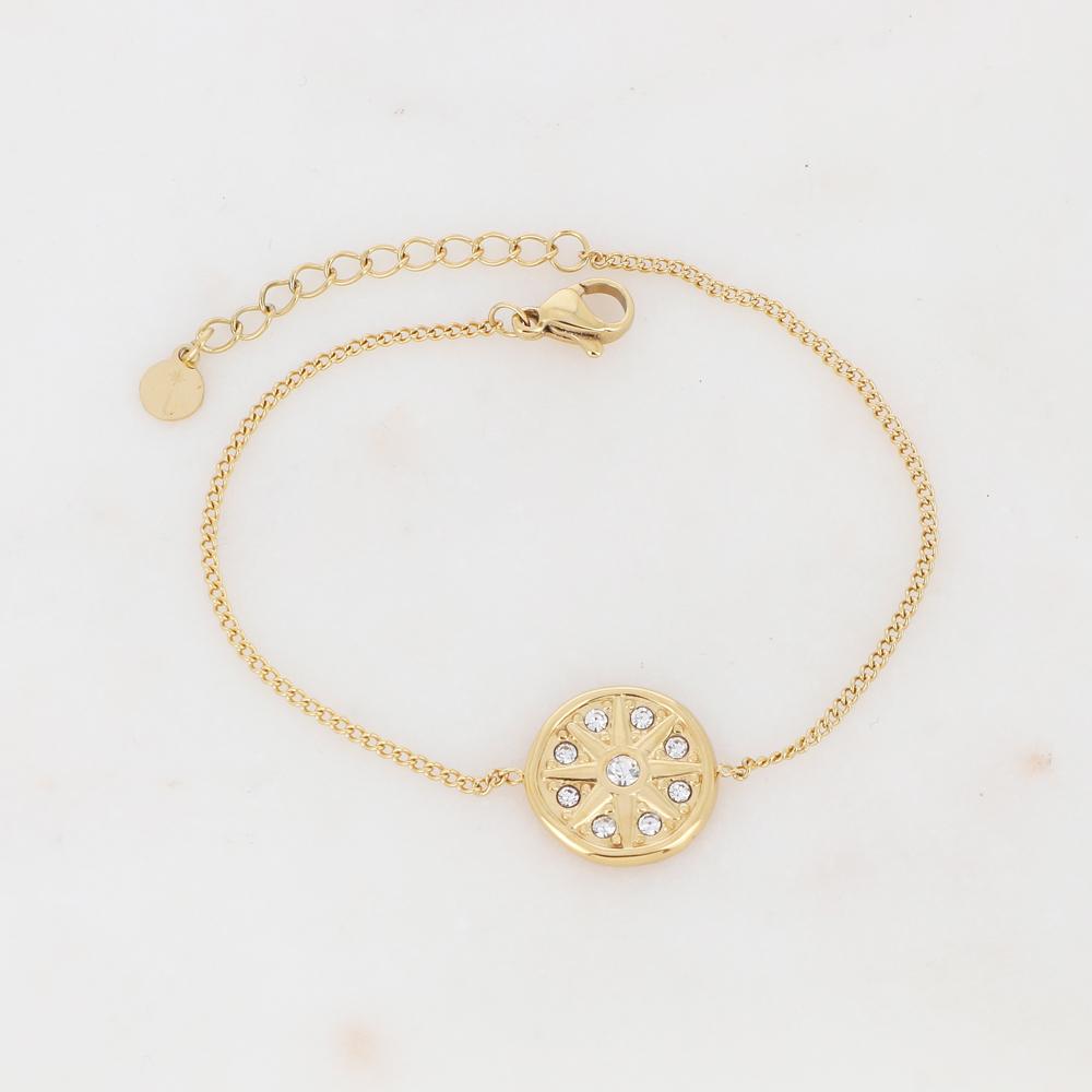 Bracelet avec un pendant rond ornée de strass