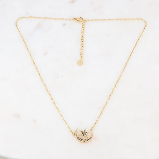 Collier doré composé d'un pendentif étoile et lune ornée de strass noirs 40+5 cm