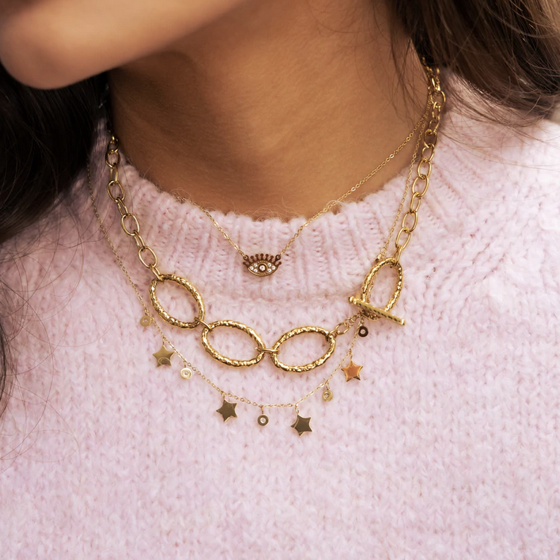 Collier doré composé de pendants étoile et de strass blancs 40+5 cm