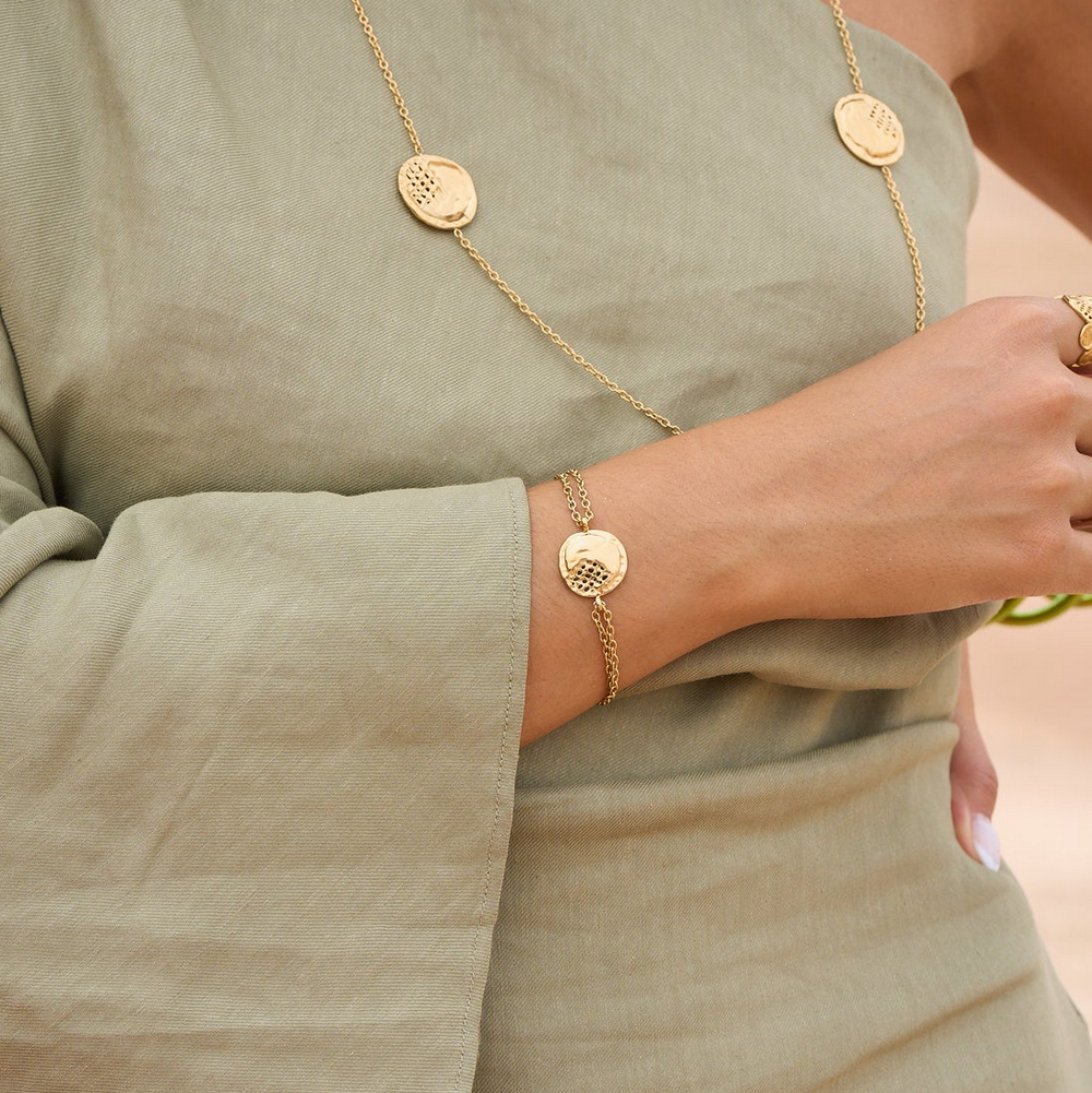 Bracelet avec pièce ronde ajourée, effet ondulé