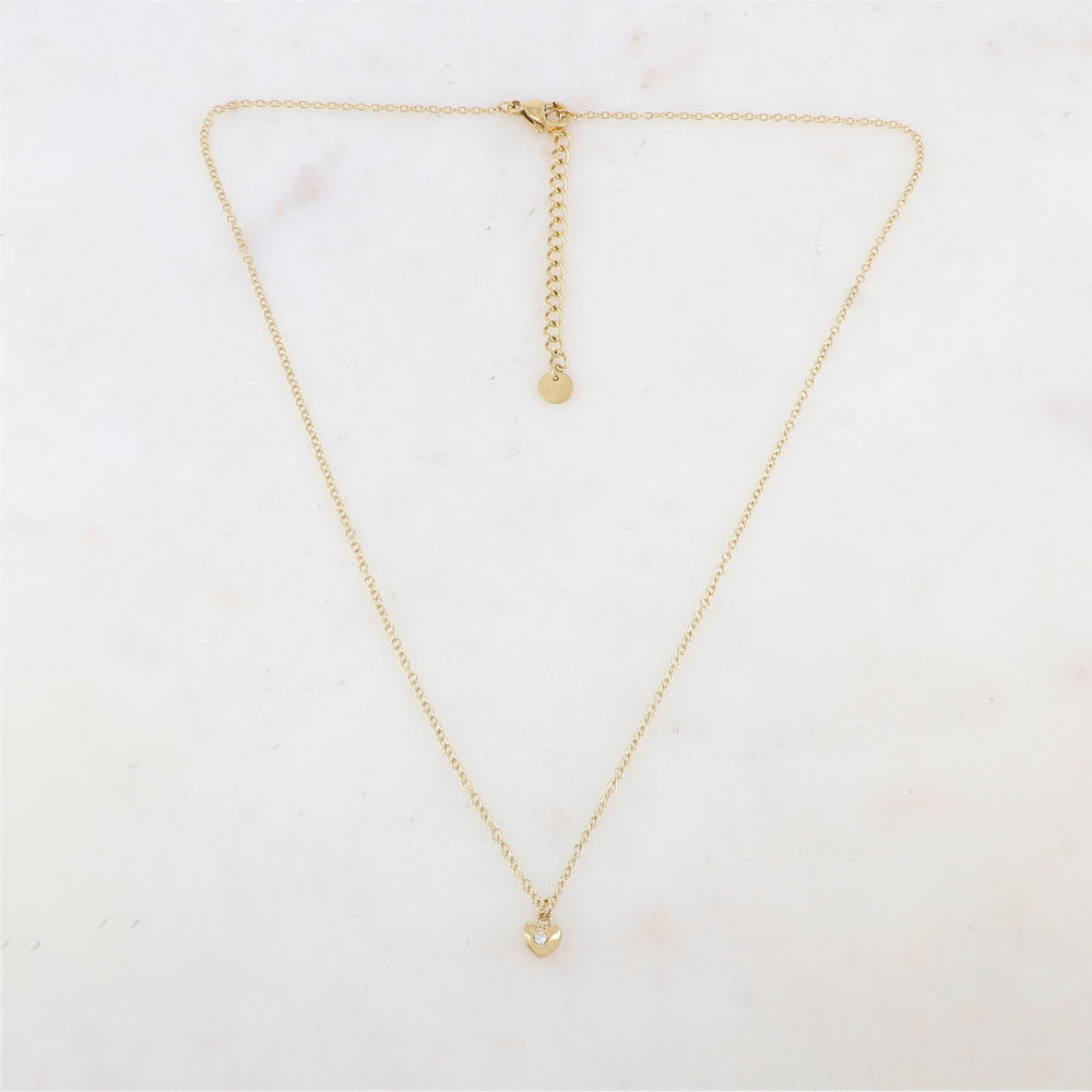 Collier doré composé d'un pendentif cœur orné d'un strass blanc 40+5 cm