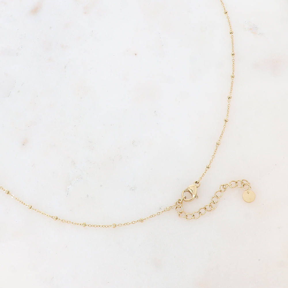 Sautoir avec un pendentif en forme d'anneau, petites rondelles, soleil, fleur