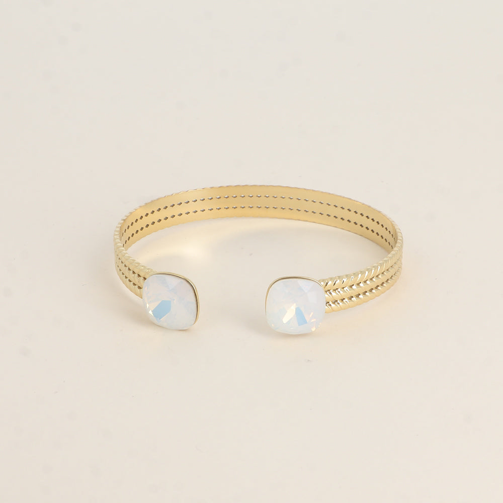 Jonc orné de cristaux de Swarovski® - White opal Dimensions du jonc : 6 x 5 cm - Hauteur du jonc: 8 mm - Dimensions des cristaux : 12 x 12 mm