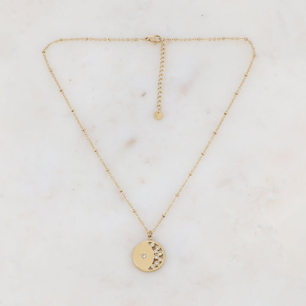 Collier doré avec pendentif rond ajouré avec un motif étoile et embelli de strass 40+5 cm