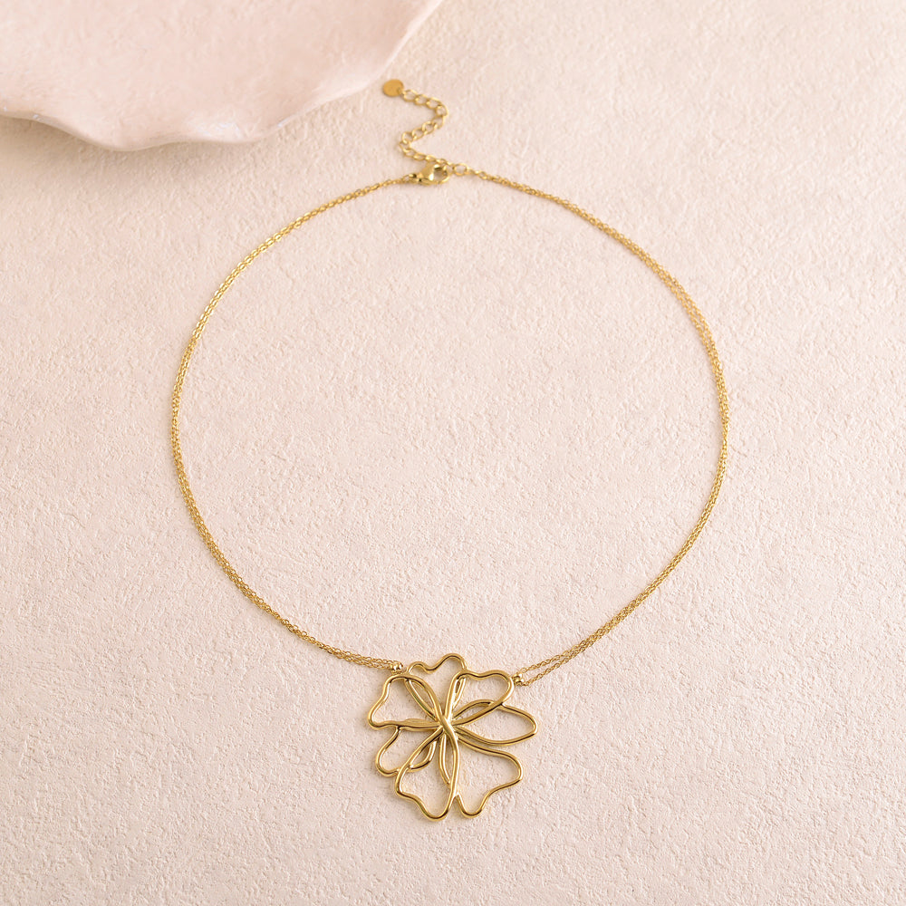Collier doré double rangs avec une pampille forme fleur ajourée 40+5 cm