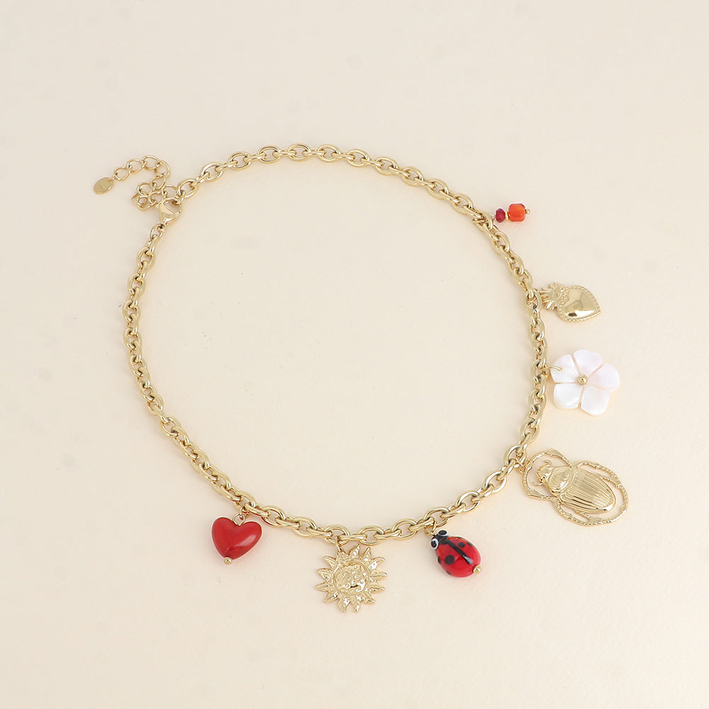 Collier - soleil, coccinelle en céramique émaillée, scarabée, fleur nacrée, cœurs 40+5 cm