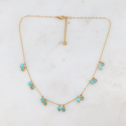 Collier doré embelli de pierres et de strass turquoises 38+5 cm