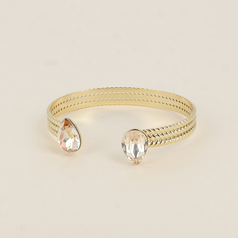 Jonc - anneau tressé orné de 2 cristaux de Swarovski® en forme de goutte - Golden shadow - Dimensions intérieures : 58 x 48 mm Epaisseur du jonc : 8 mm