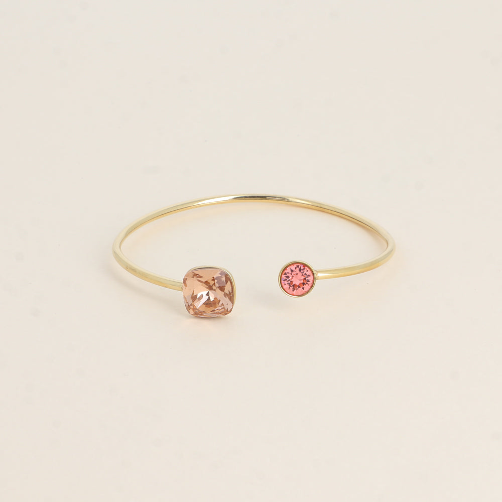 Jonc orné de cristaux de Swarovski® 10 mm et SS29 - Hauteur du jonc: 11 mm - Dimension du cristal 1: 10x10 mm - Diamètre du cristal 2: 7 mm - Vintage rose and rose peach