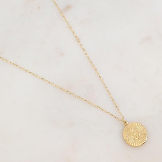 Collier doré avec un pendentif rond effet soleil et serpent 41+5 cm