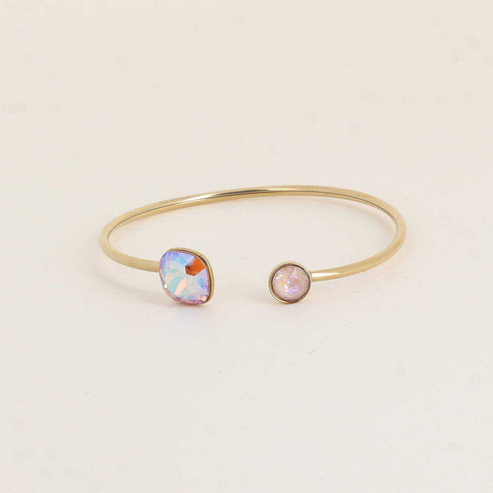 Jonc orné de cristaux de Swarovski® 10 mm et SS29 - Hauteur du jonc: 11 mm - Dimension du cristal 1: 10x10 mm - Diamètre du cristal 2: 7 mm - Light Colorado topaz shimmer et dusty pink