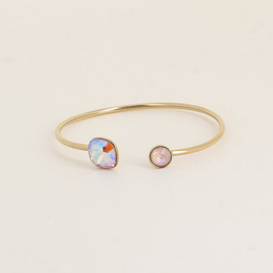 Jonc orné de cristaux de Swarovski® 10 mm et SS29 - Hauteur du jonc: 11 mm - Dimension du cristal 1: 10x10 mm - Diamètre du cristal 2: 7 mm - Light Colorado topaz shimmer et dusty pink