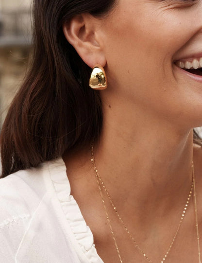 Créoles à puce bombées avec effet miroir et lisse Diamètre : 3 cm.