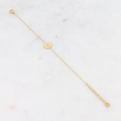 Bracelet avec pièce ronde et strass