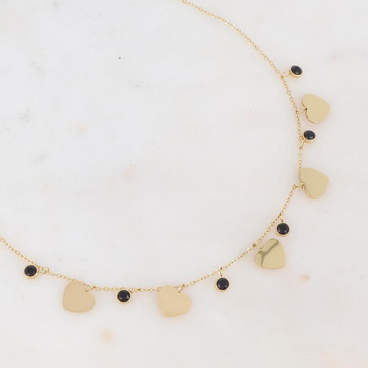 Collier doré composé de pendants cœur et de strass noirs 41+5 cm