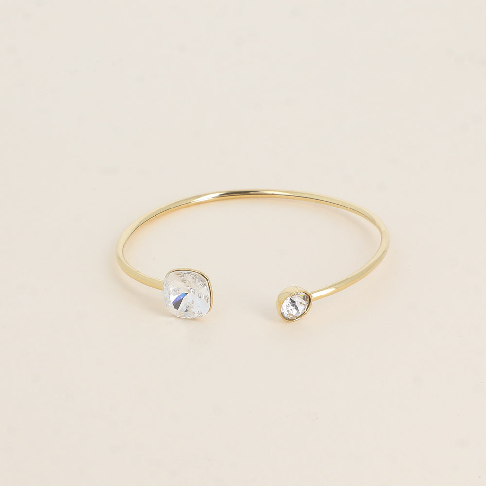 Jonc orné de cristaux de Swarovski® 10 mm et SS29 - Hauteur du jonc: 11 mm - Dimension du cristal 1: 10x10 mm - Diamètre du cristal 2: 7 mm - Crystal