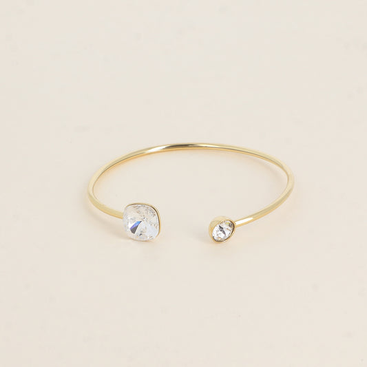 Jonc orné de cristaux de Swarovski® 10 mm et SS29 - Hauteur du jonc: 11 mm - Dimension du cristal 1: 10x10 mm - Diamètre du cristal 2: 7 mm - Crystal