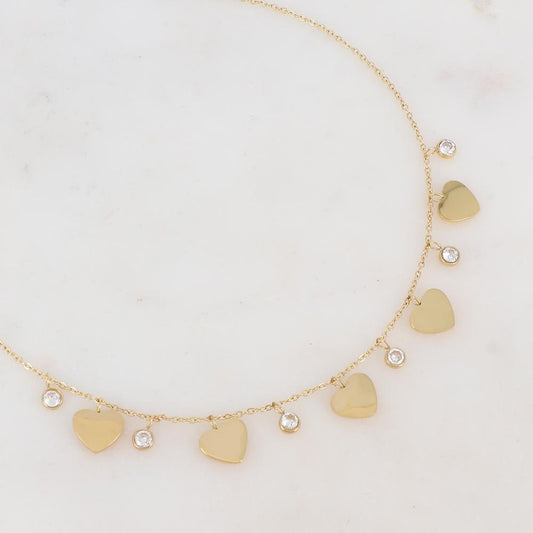 Collier doré composé de pendants cœur et de strass blancs 41+5 cm