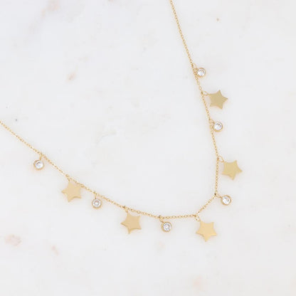 Collier doré composé de pendants étoile et de strass blancs 40+5 cm