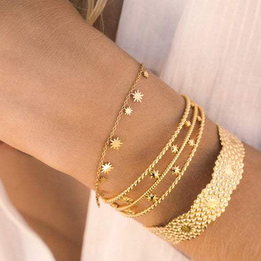 Bracelet avec pampilles au motif solaire