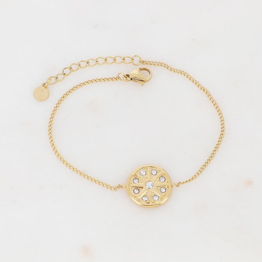 Bracelet avec un pendant rond ornée de strass