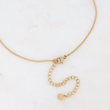 Collier sur chaîne doré composé d'un pendentif étoile émaillé noir serti d'un strass noir 38+8 cm