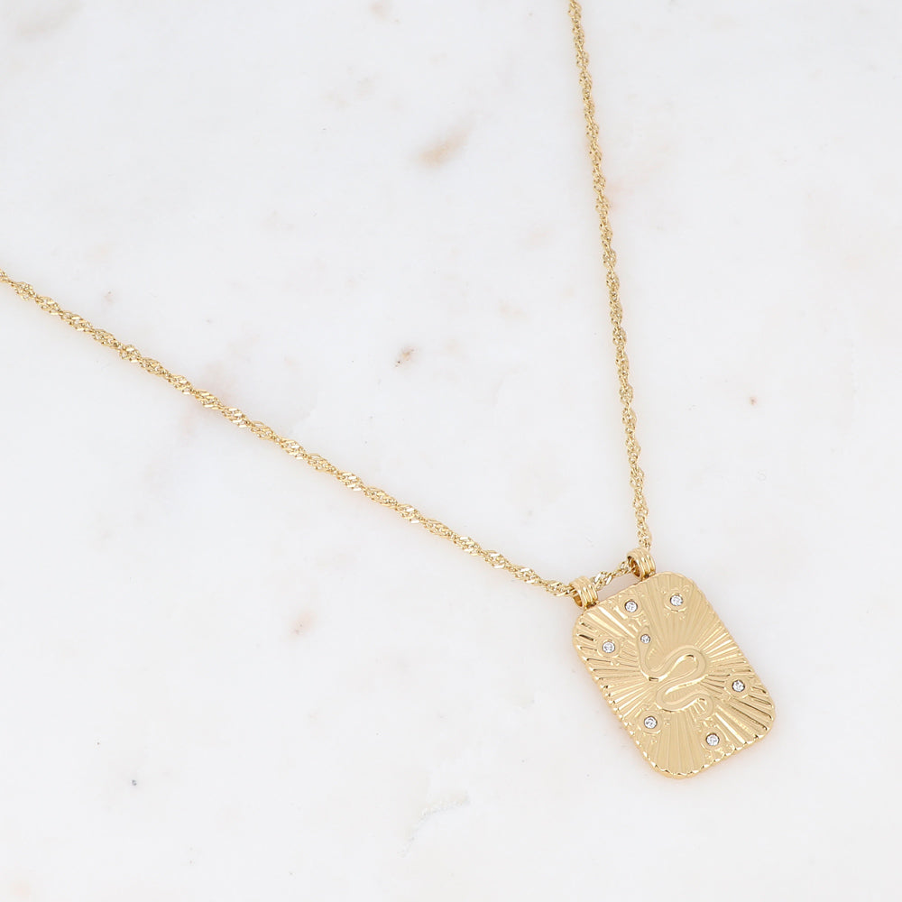 Collier sur chaîne doré composé d'une pièce rectangulaire motif serpent ornée de strass blancs 40+5 cm