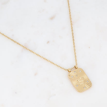 Collier sur chaîne doré composé d'une pièce rectangulaire motif serpent ornée de strass blancs 40+5 cm