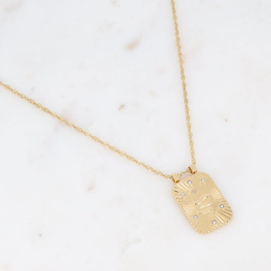 Collier sur chaîne doré composé d'une pièce rectangulaire motif serpent ornée de strass blancs 40+5 cm