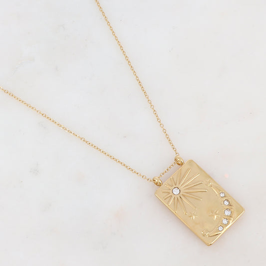 Collier doré avec une pampille rectangulaire ornée d'étoile, d'un soleil et d'une lune et de strass blancs 40+5 cm
