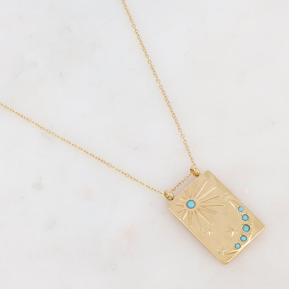 Collier doré avec une pampille rectangulaire ornée d'étoile, d'un soleil et d'une lune et de strass turquoises(40+5CM)