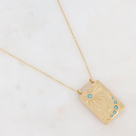 Collier doré avec une pampille rectangulaire ornée d'étoile, d'un soleil et d'une lune et de strass turquoises(40+5CM)