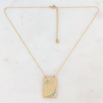Collier doré avec une pampille rectangulaire ornée d'étoile, d'un soleil et d'une lune et de strass turquoises(40+5CM)