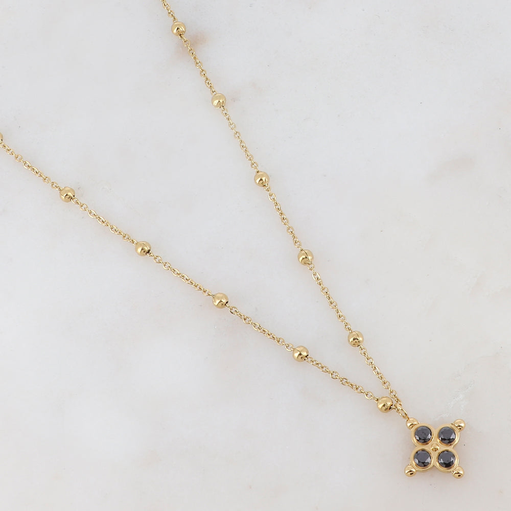 Collier doré composé de petites boules et d'un pendentif embelli de strass noirs 38+7 cm