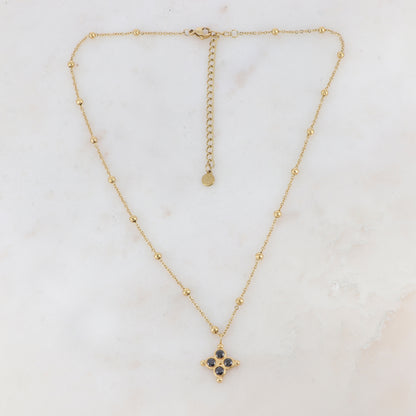 Collier doré composé de petites boules et d'un pendentif embelli de strass noirs 38+7 cm