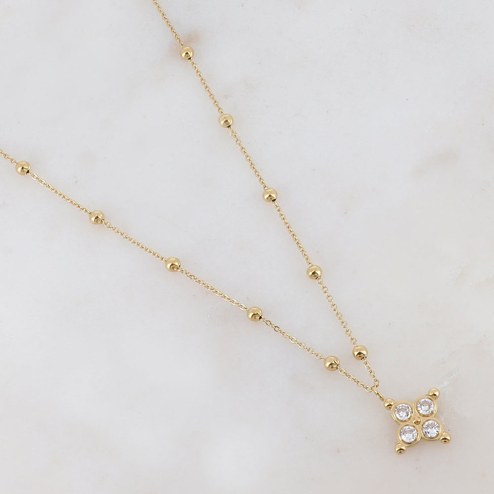 Collier doré composé de petites boules et d'un pendentif embelli de strass blancs 38+7 cm
