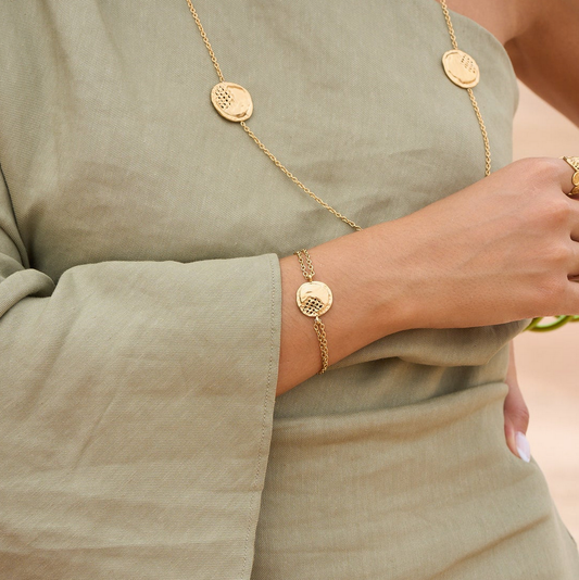 Bracelet avec pièce ronde ajourée, effet ondulé