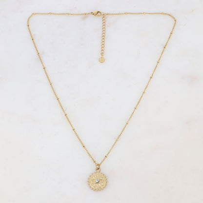 Collier doré avec un pendentif rond motif œil, strass blanc 45+5 cm