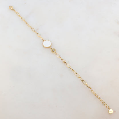 Bracelet en maille avec pièce ronde émaillée, strass, étoile et petite boule
