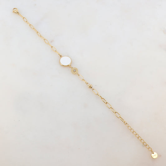 Bracelet en maille avec pièce ronde émaillée, strass, étoile et petite boule