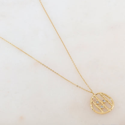Collier doré avec pendentif rond et strass blancs 38+7 cm