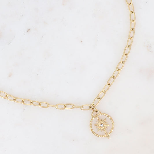 Collier doré avec un pendentif rond orné d'une étoile et d'un strass blanc 40+5 cm