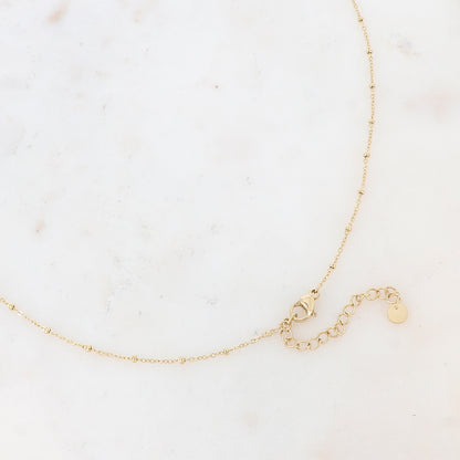 Sautoir avec un pendentif en forme d'anneau, petites rondelles, soleil, fleur