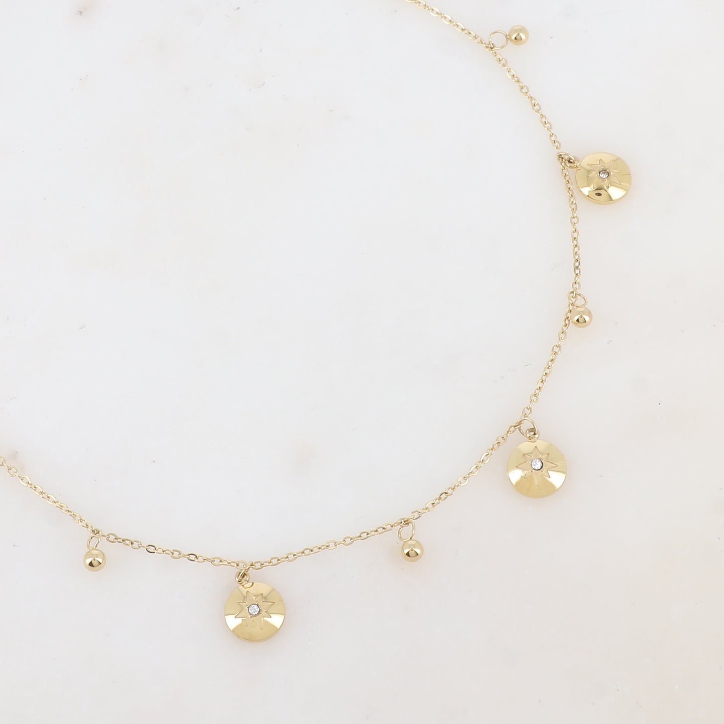 Collier avec pampilles boules et rondes avec motif étoile et strass (38+7CM)