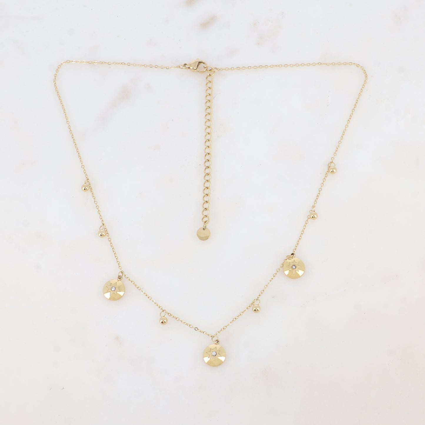 Collier avec pampilles boules et rondes avec motif étoile et strass (38+7CM)