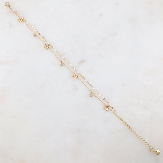 Chaîne de cheville 2 rangs avec pièces émaillées, fleurs et pampilles rondes serties d'un strass (21+5CM)