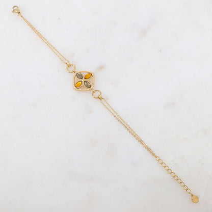 Bracelet avec deux anneaux ronds, un anneau carré et quatre pâtes de verre ovales
