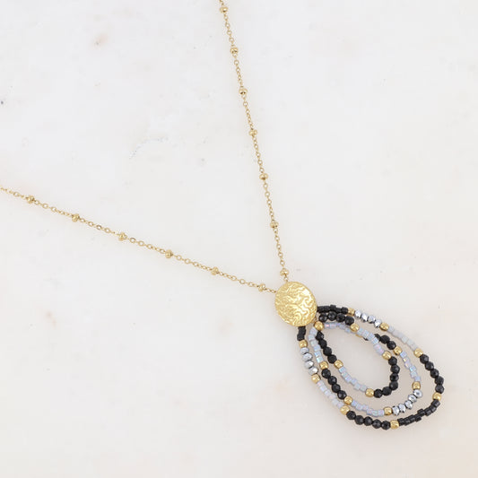 Collier avec pièce martelée ovale, perles de rocaille et pâtes de verre (55+5CM)